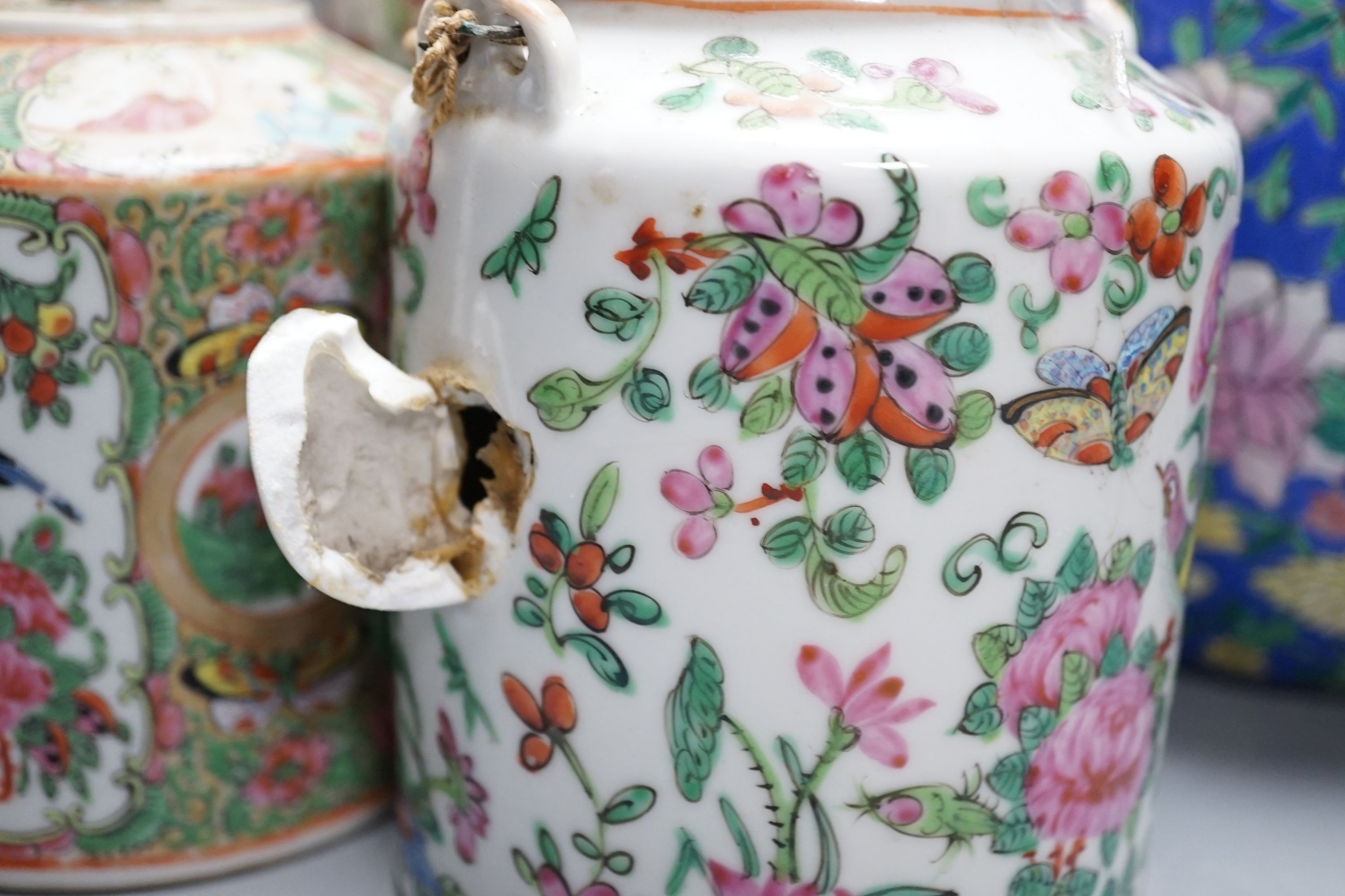 Two Chinese famille rose vases, two Chinese famille rose teapots and a blue ground enamelled jar tallest 26.5cm